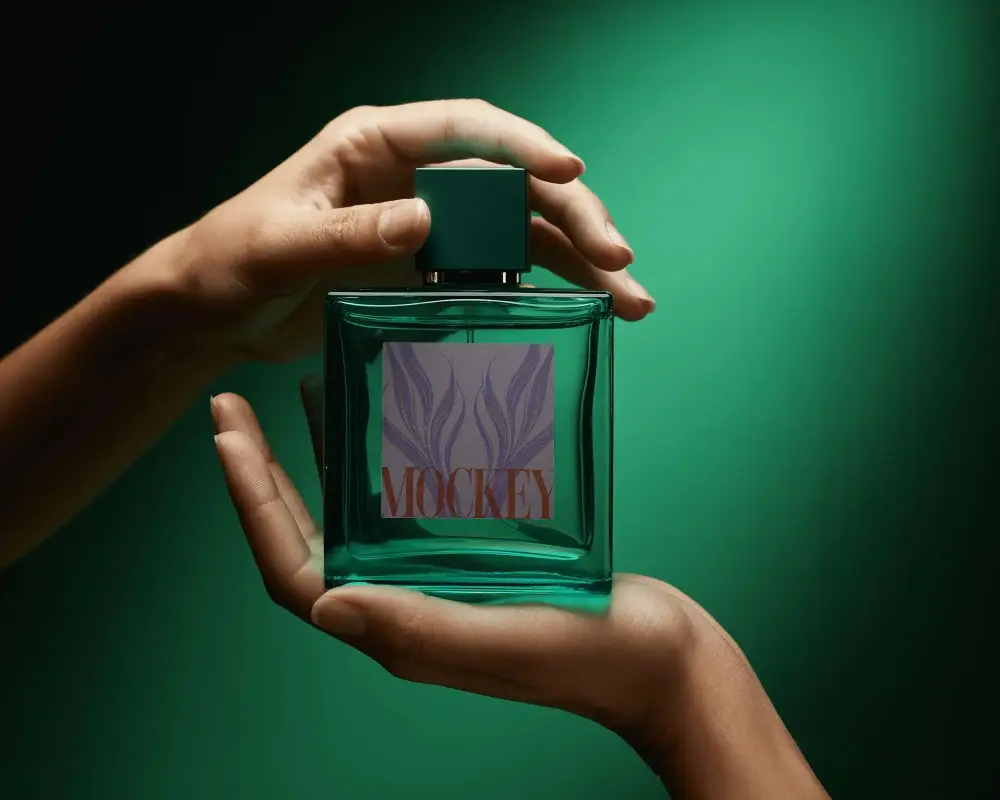 Luxury Perfume Mockup Green Glass Bottle Held In Hands With Dark Gradient Background