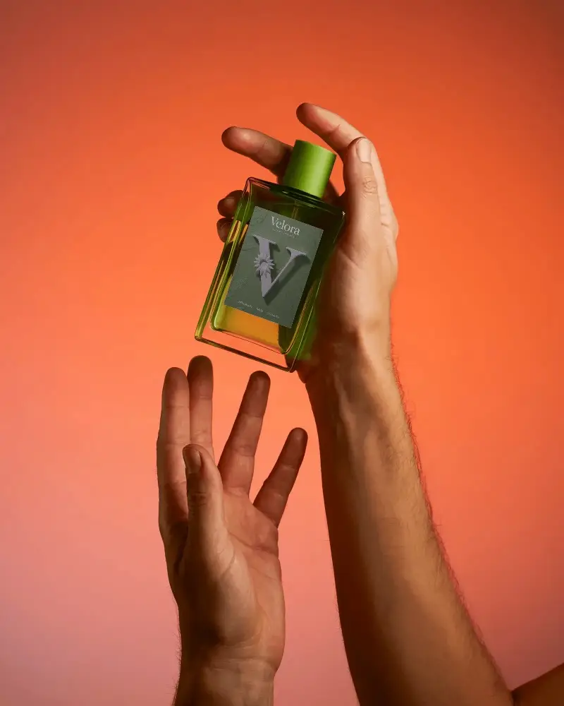 Luxury Perfume Bottle Mockup With Hands Presenting Elegant Scent Product Design