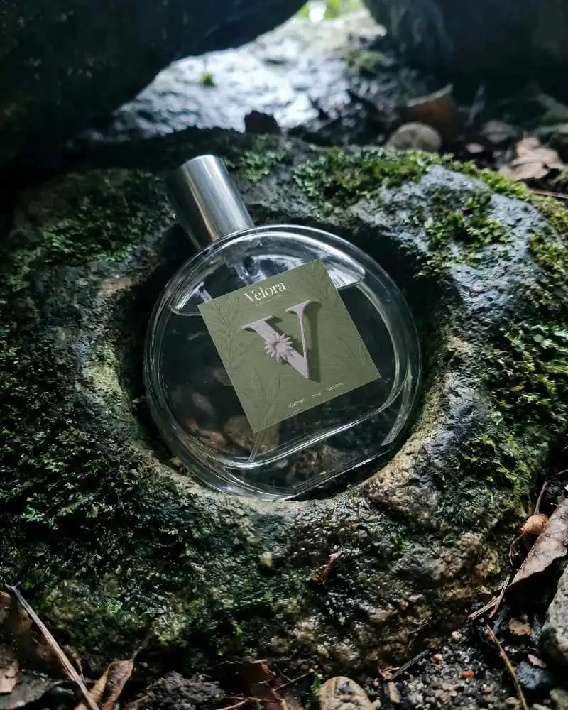 Elegant Glass Perfume Mockup On Natural Mossy Stone Background For Branding