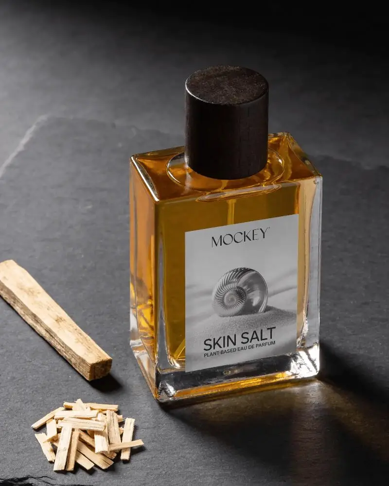Elegant Perfume Container Display With Natural Wood Chip Elements Fragrance Packaging Design