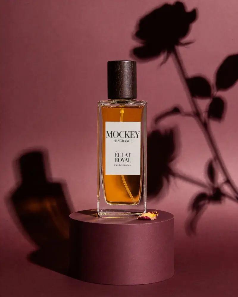 Elegant Floral Perfume Bottle Mockup With Wooden Cap And Shadow Effect For Brand Promotion