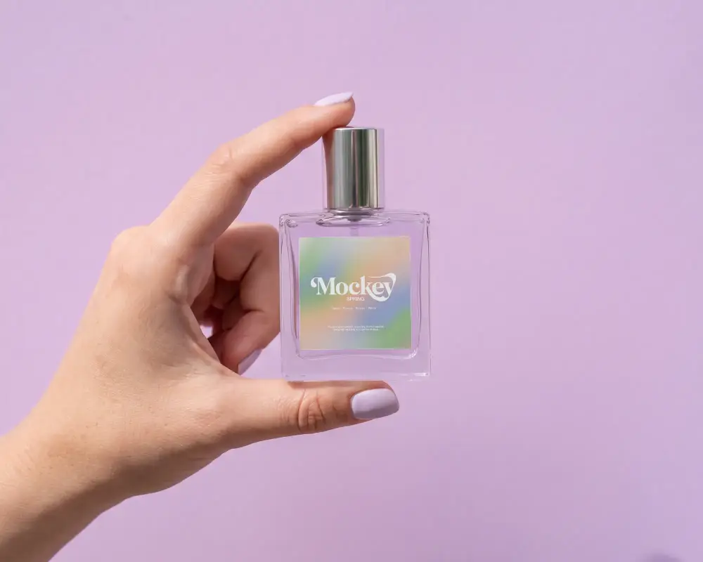 Hand Holding Glass Perfume Bottle Mockup With Minimalist Label Mockup For Branding