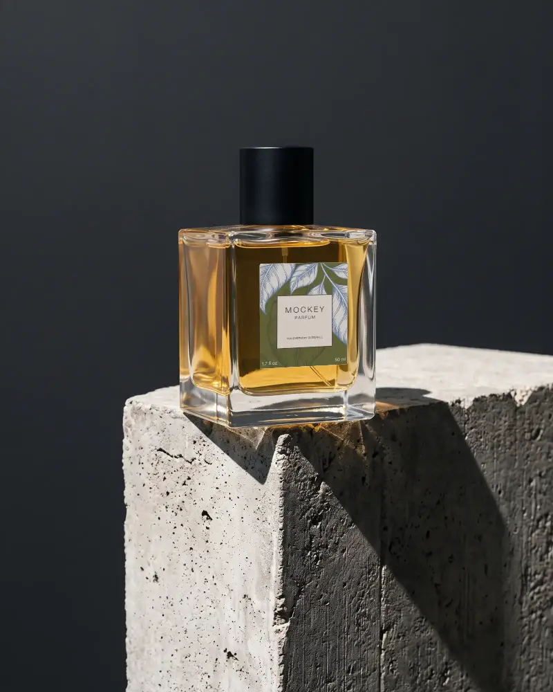 Luxury Perfume Bottle Mockup On Textured Stone Surface For Branding Presentation