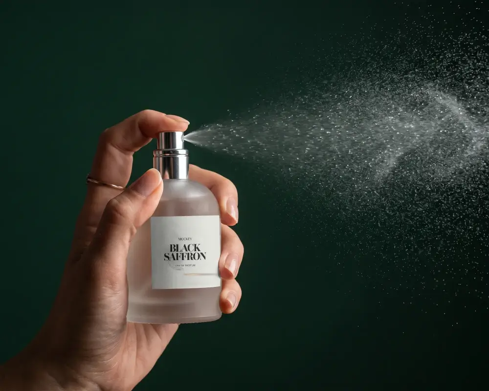 Luxury Perfume Spray Mockup Showcasing Fine Mist Dispersion And Clear Glass Bottle