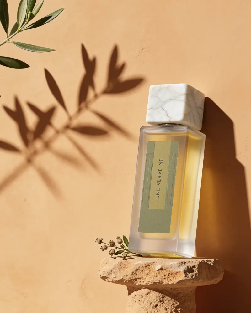 Luxury Perfume Bottle Mockup With Minimalist Design On Textured Stone Pedestal Background