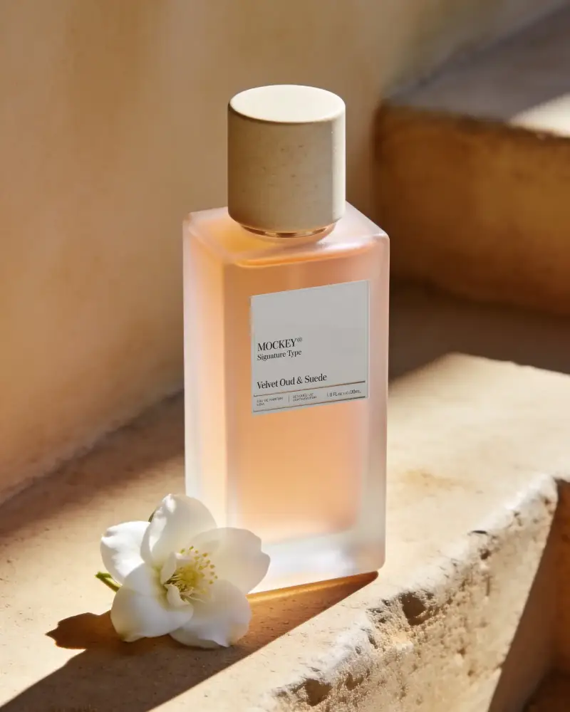 High End Fragrance Bottle Mockup With Natural Lighting And Floral Accent For Branding