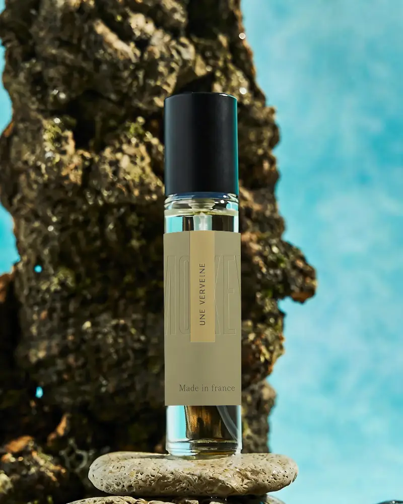 Natural Fragrance Bottle Mockup On Wooden And Stone Background For Brand Advertising