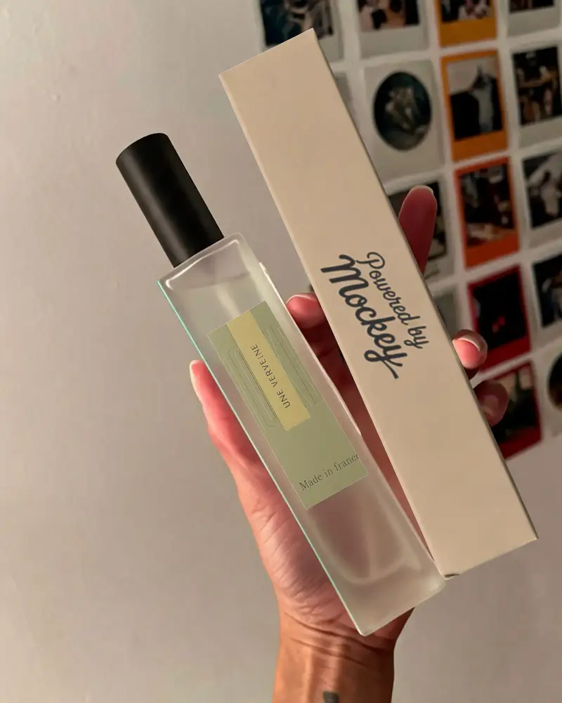 Hand Held Luxury Perfume Mockup With Simple Box And Clear Glass Bottle Design