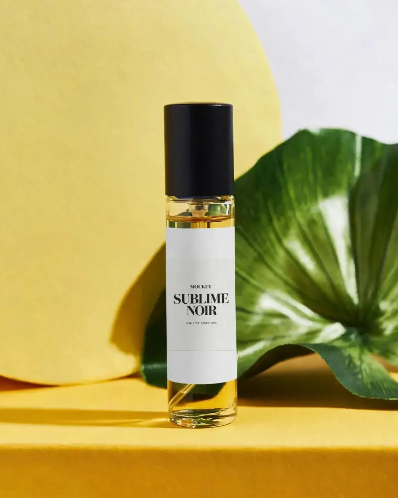 Elegant Glass Perfume Mockup With Custom Label On Natural Leaf Background