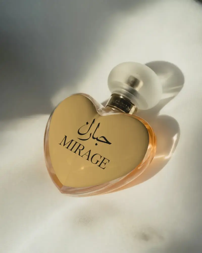 Premium Glass Heart Perfume Bottle Bottle With Unique Cap Fragrance Mockup For Brand Presentation