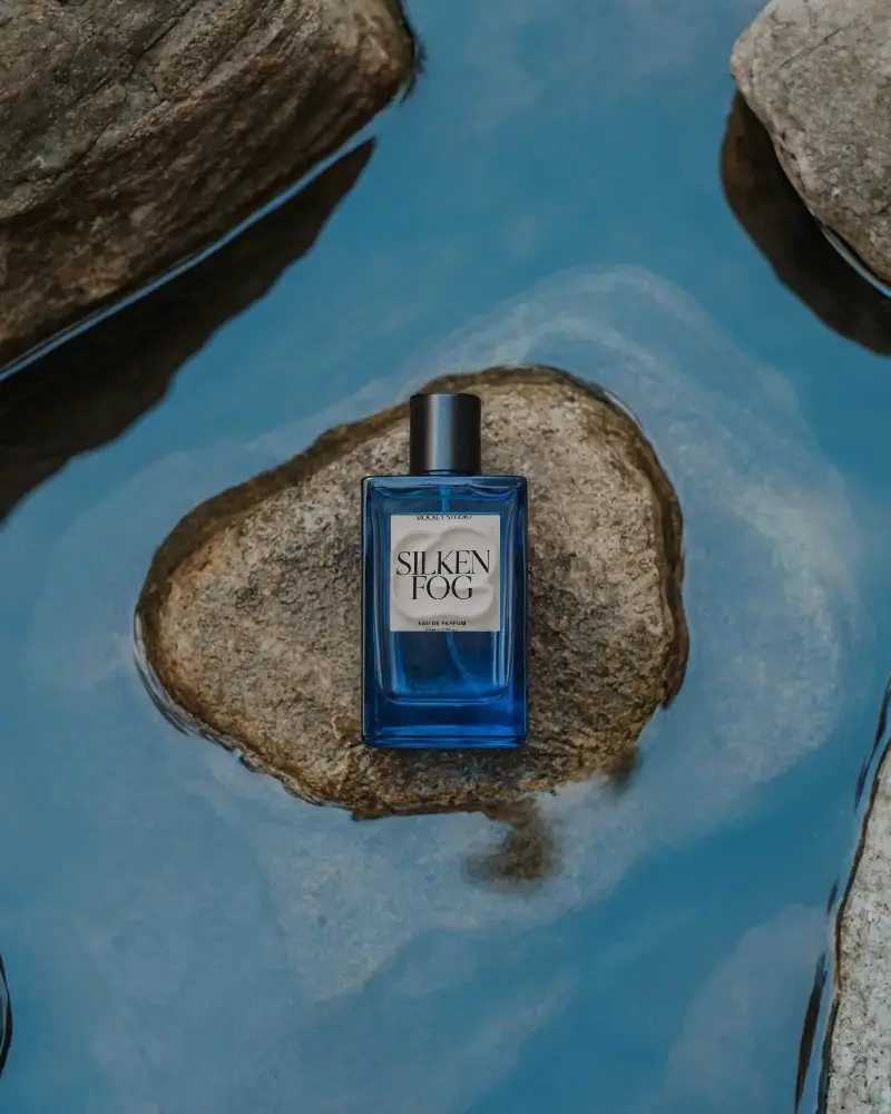 Luxury Perfume Bottle Mockup On Natural Stone With Reflective Water Surface Background