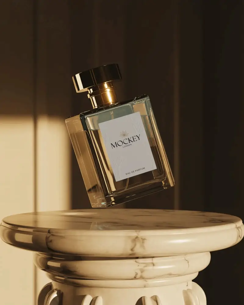 Stylish Perfume Mockup Square Bottle With Golden Cap Placed On Classical Marble Column Display