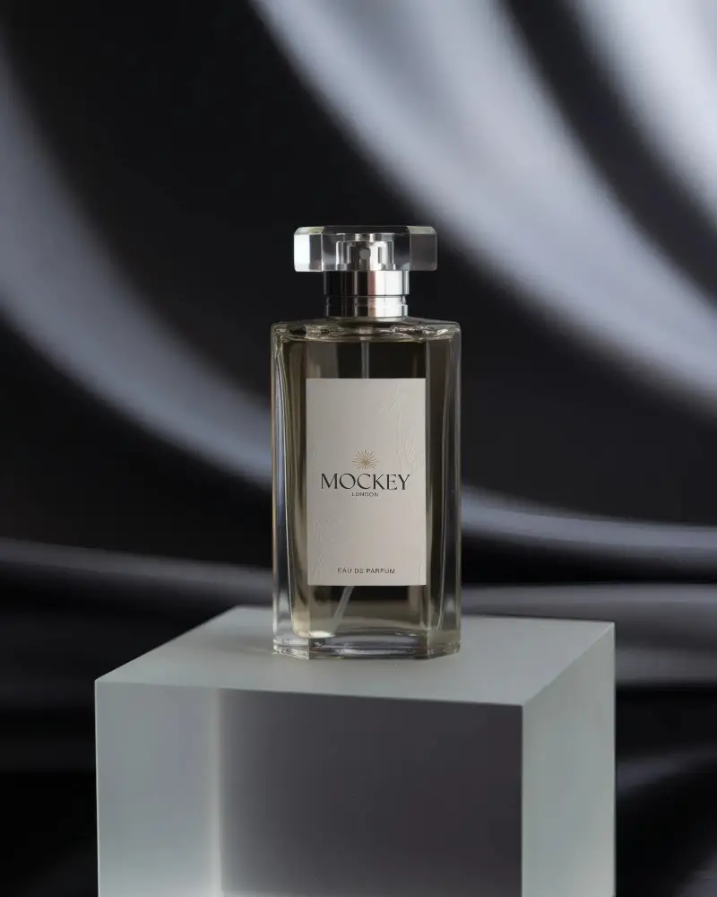 elegant-luxury-perfume-bottle-mockup-on-minimalist-pedestal-with-dark-flowing-background