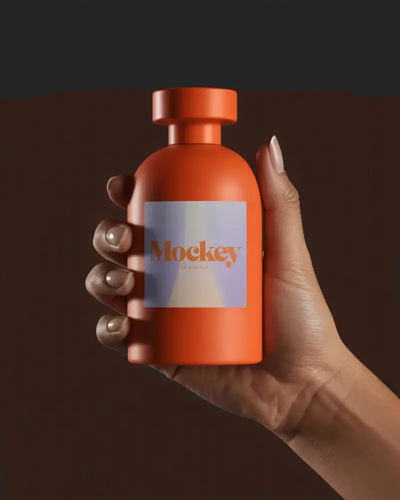 Bold Orange Perfume Mockup Held In Hand Against Clean Dark Minimal Background