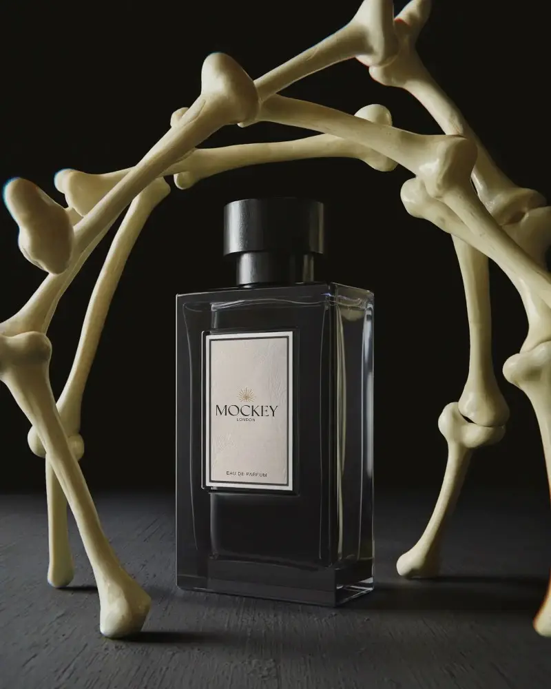 Modern Luxury Perfume Bottle Mockup With Bones Surrounding Dramatic Dark Background