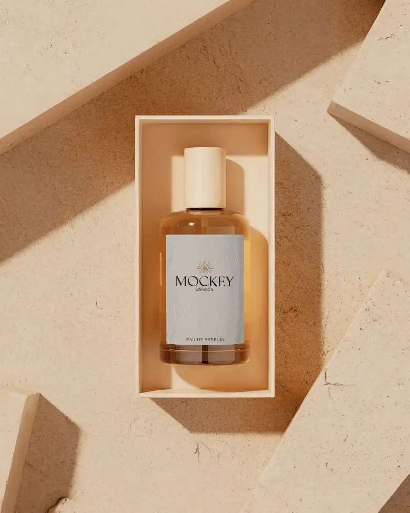 Boxed Perfume Mockup Glass Bottle In Minimal Packaging Warm Stone Background