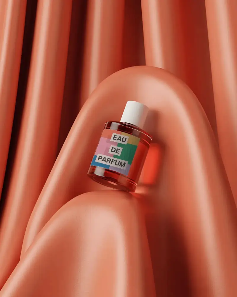 Elegant Perfume Bottle Mockup On Soft Wavy Fabric Background For Luxury Brand Display