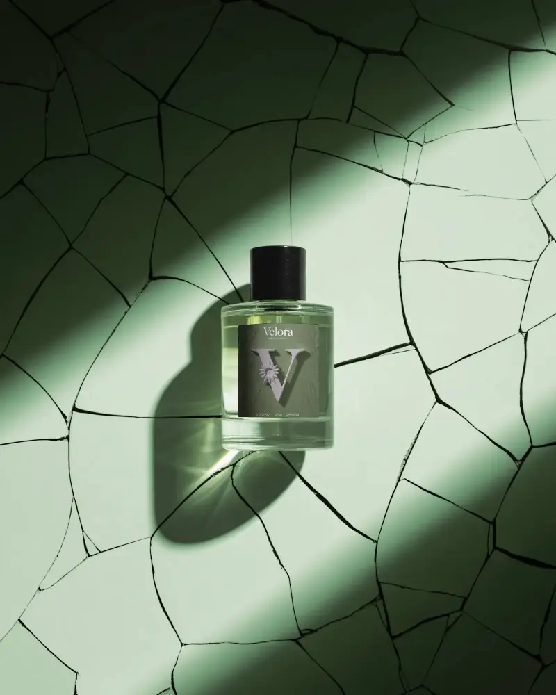 luxury-perfume-mockup-glass-bottle-design-on-cracked-green-stone-background
