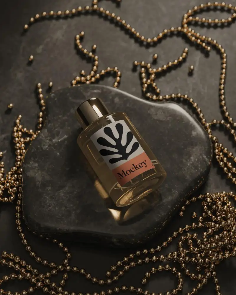 Luxury Perfume Mockup Glass Bottle On Dark Stone With Golden Beads