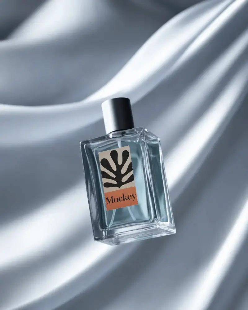 luxury-perfume-bottle-mockup-floating-on-smooth-satin-fabric-minimal-modern-studio-lighting