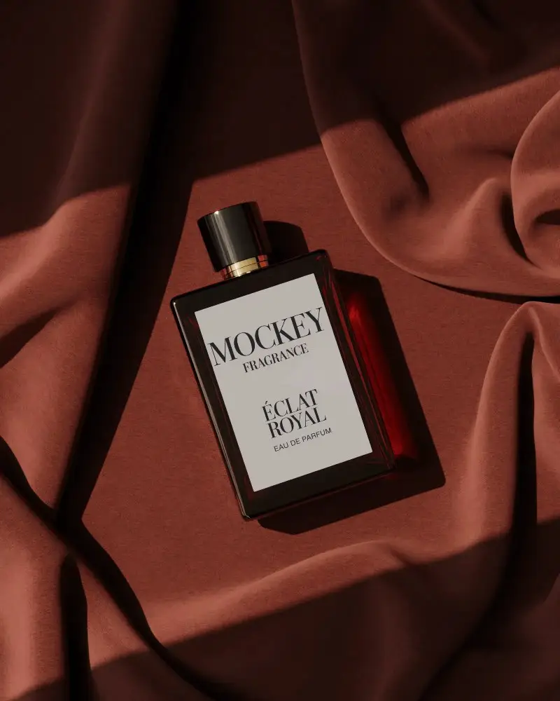 luxury-perfume-bottle-mockup-lying-on-rich-red-fabric-with-soft-shadows-premium-stylish-display