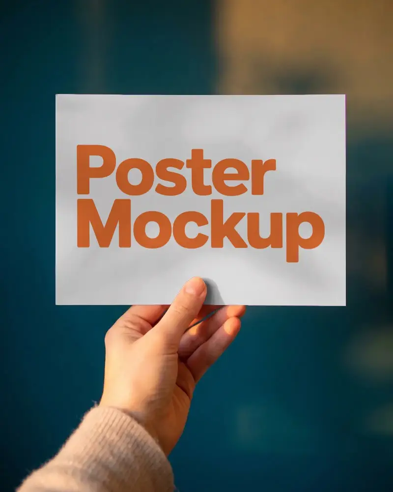 Hand Holding Poster Mockup For Design Presentation And Creative Work Showcase