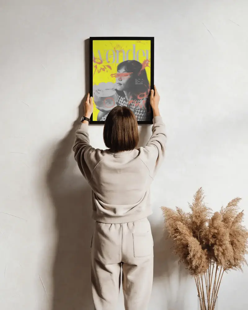 Woman Hanging Poster Mockup On Textured Wall Interior With Decorative Plants