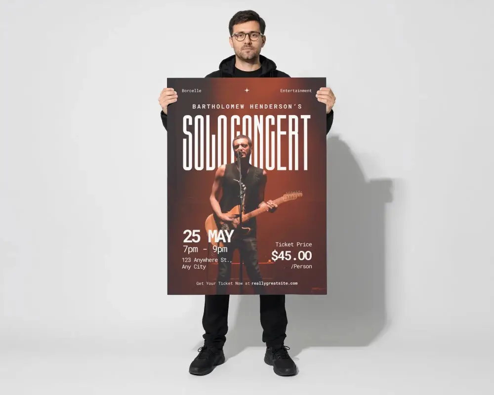 Man Holding Large Poster Mockup Standing Against Minimalist Wall Background Studio