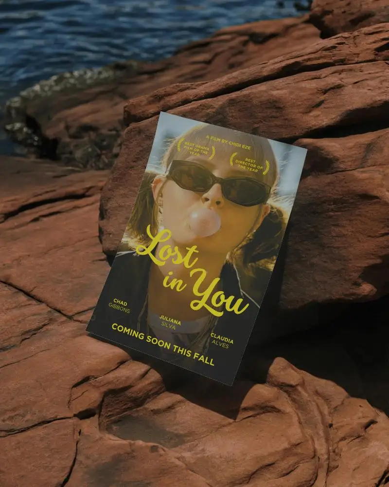 Blank Vertical Poster Mockup Leaning Against Natural Rock Surface Near Water Body