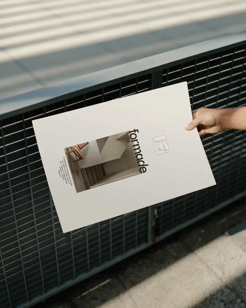 Hand Holding Blank Poster Against Metal Grid Background Outdoor Mockup