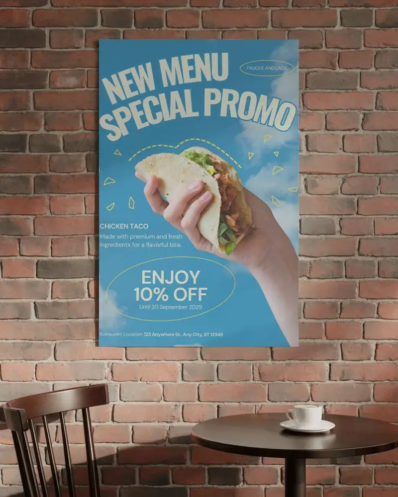 Modern Cafe Interior With Brick Wall And Poster Mockup Above Round Table Setting