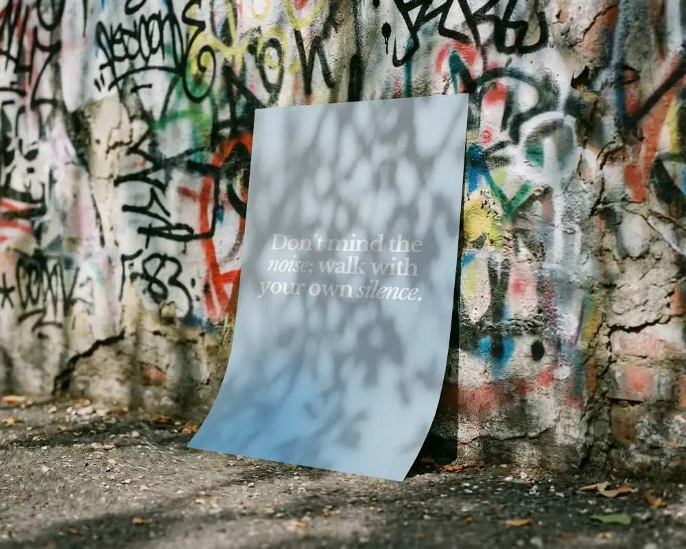 Blank Simple Poster Mockup Display Against Textured Graffiti Wall With Natural Shadow Play