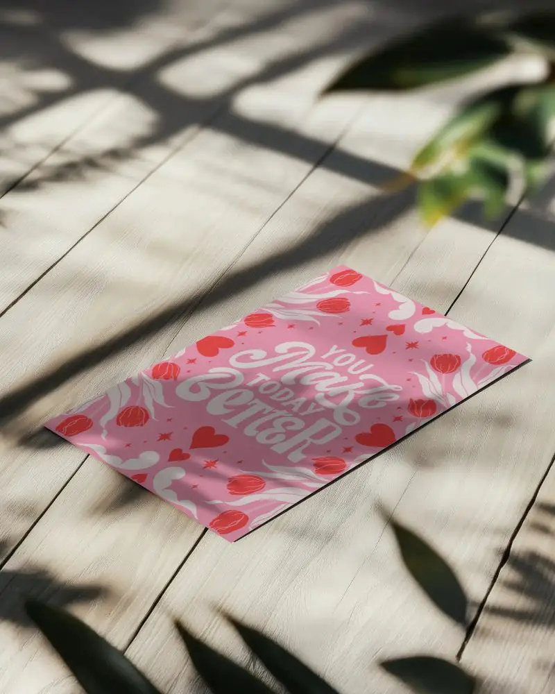 Angled Paper Mockup On Light Wooden Floor Casting Natural Shadows Minimalist Presentation Under Soft Sunlight