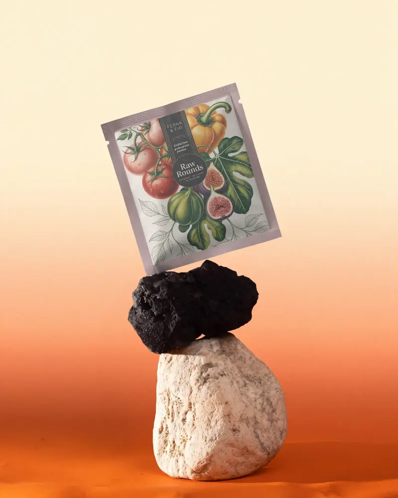 Eco Friendly Foil Sealed Pouch Mockup Balancing On Natural Stone Background For Branding