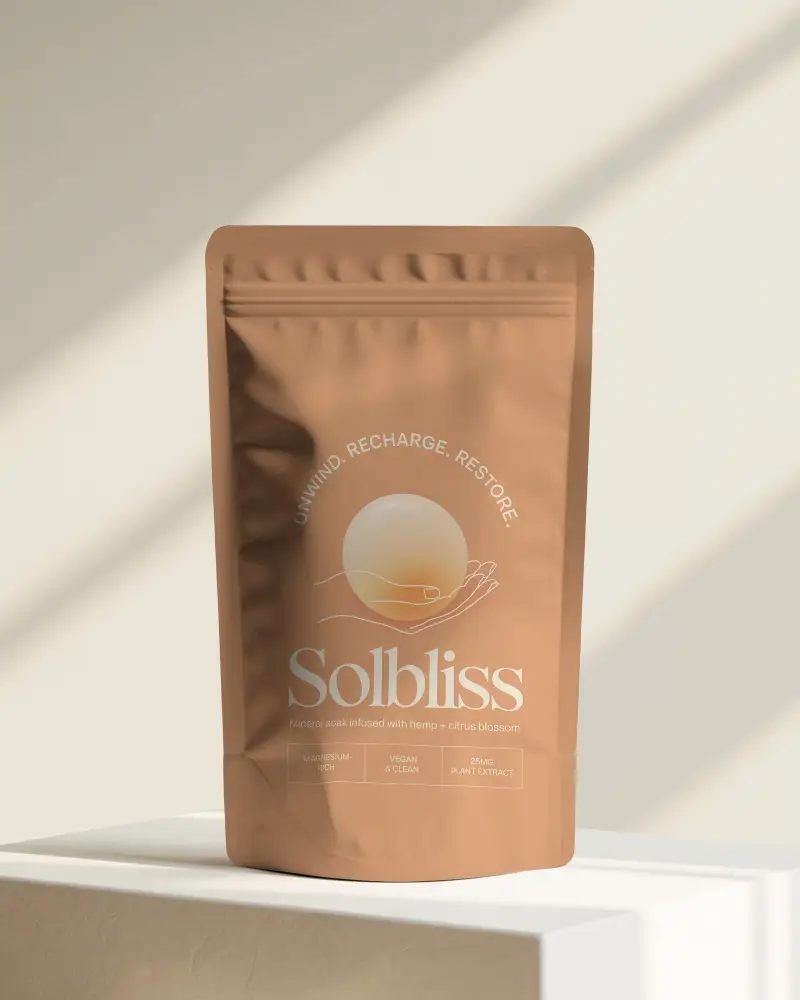 Sunlit Studio Pouch Mockup Standing On Pedestal With Soft Warm Beige Shadows