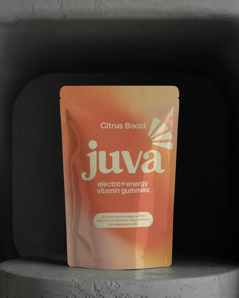 Glossy Pouch Mockup On Round Cement Podium Inside Moody Dark Arched Room For Luxury Packaging