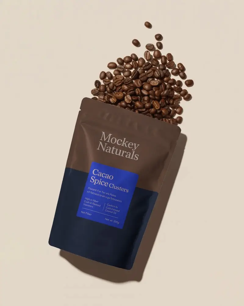 Resealable Stand Up Pouch Mockup With Spilled Coffee Beans Isolated On Light Background
