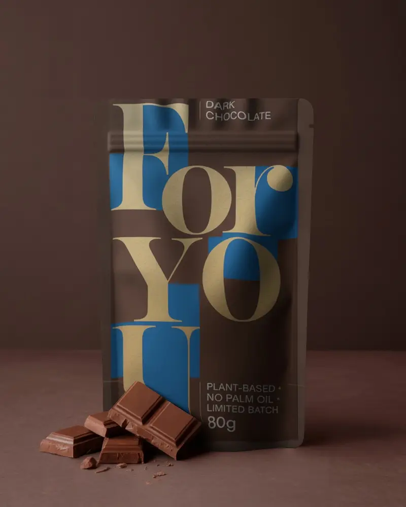 Stand Up Pouch Packaging Mockup With Chocolate Squares For Product Presentation Design