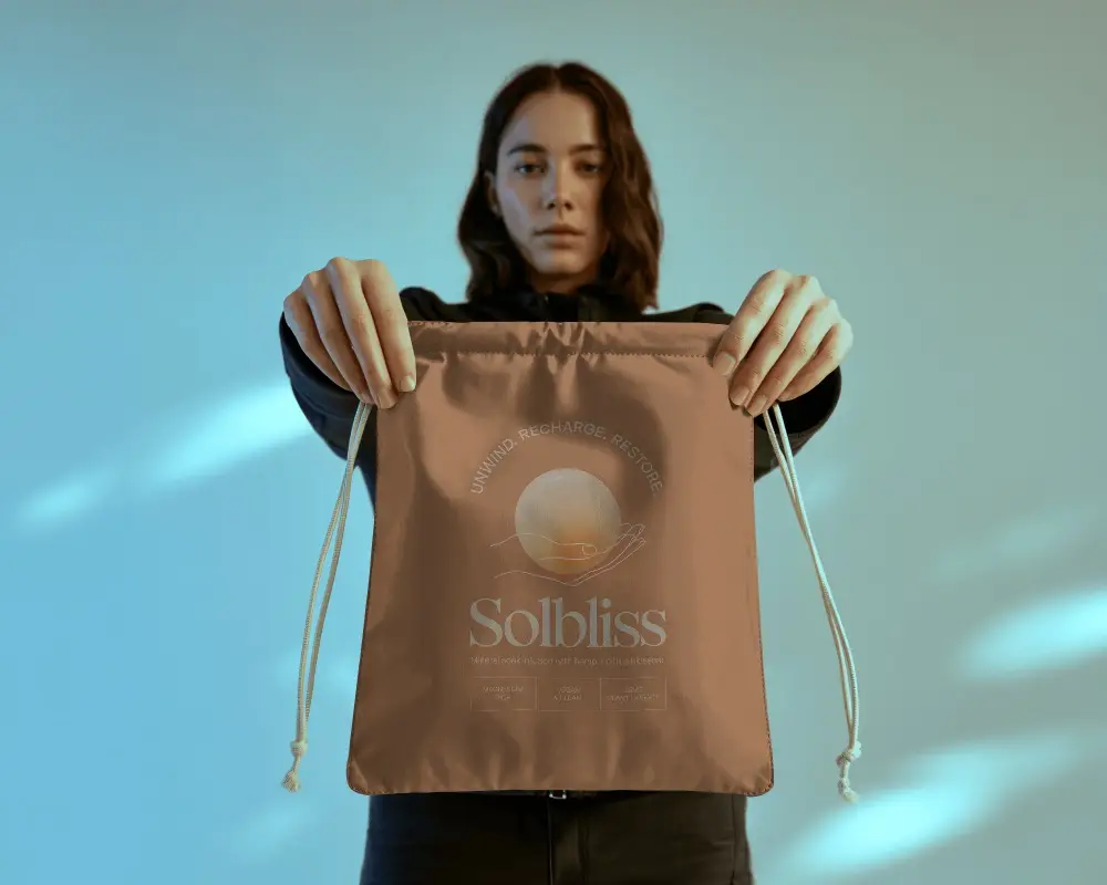 Drawstring Pouch Mockup Held By Model Front View With Clean Studio Light