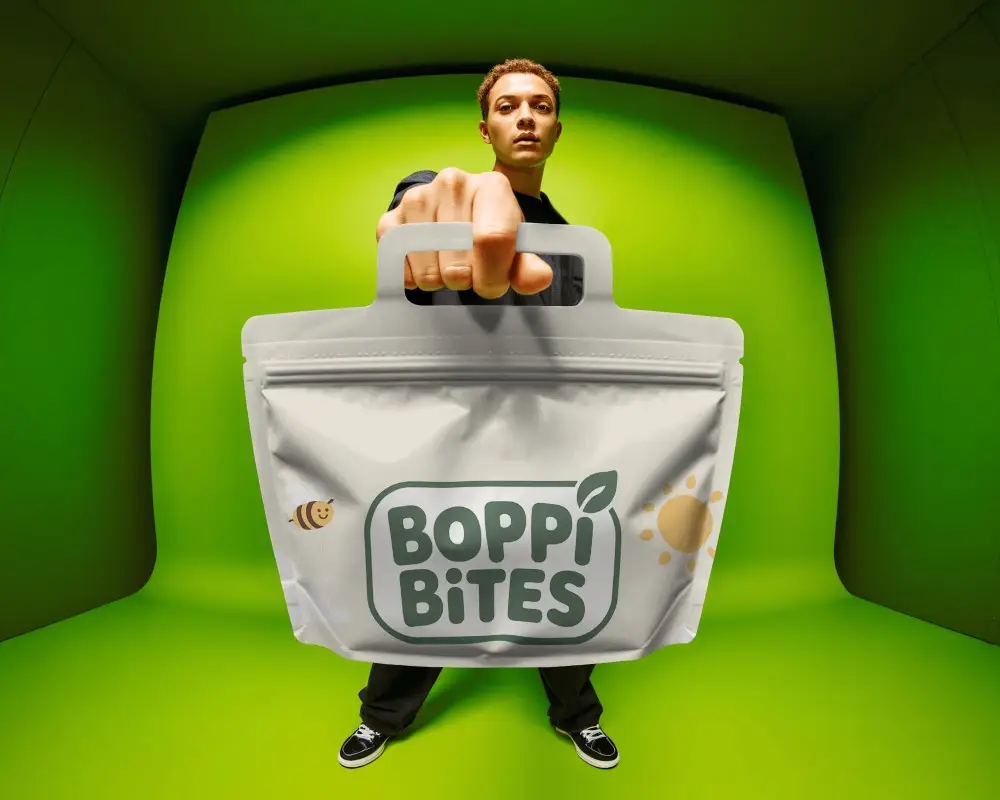 Lifestyle Handle Pouch Mockup Hero Shot With Model And Vibrant Green Background