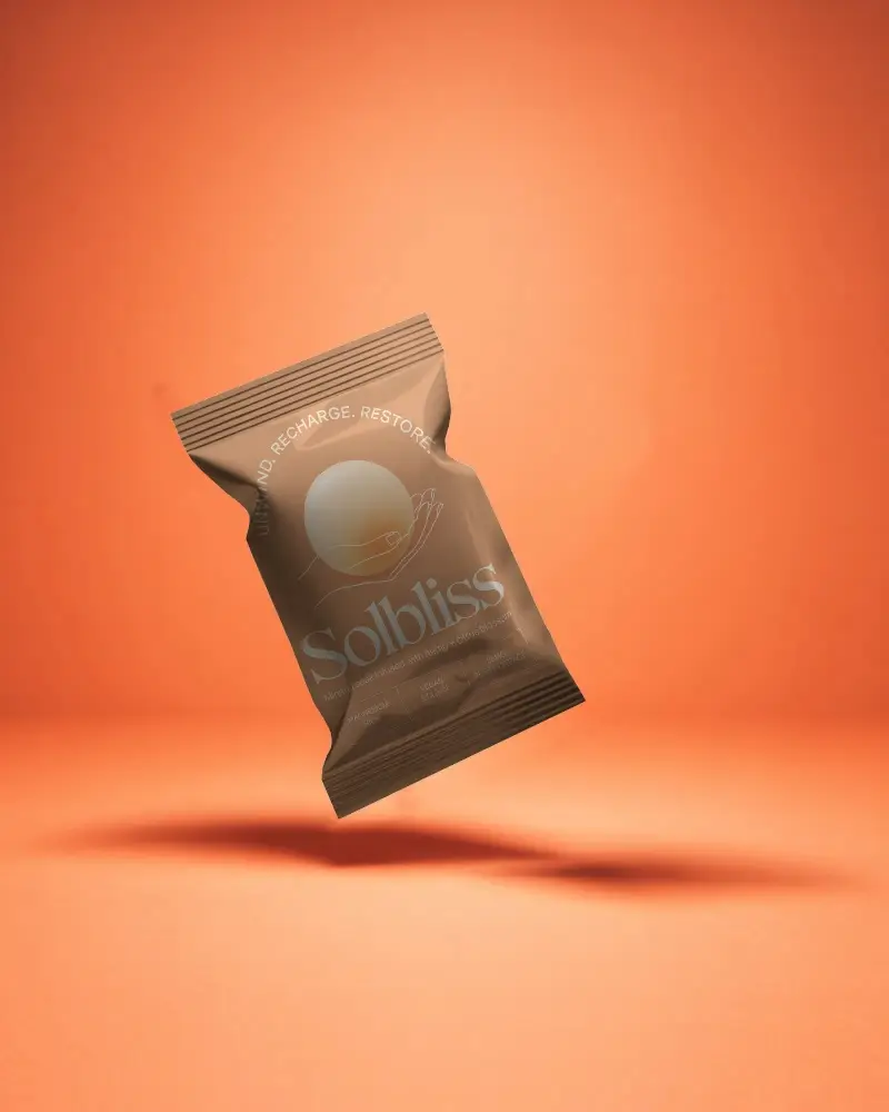 Premium Flexible Food Packaging Pouch Mockup Floating Over Orange Background
