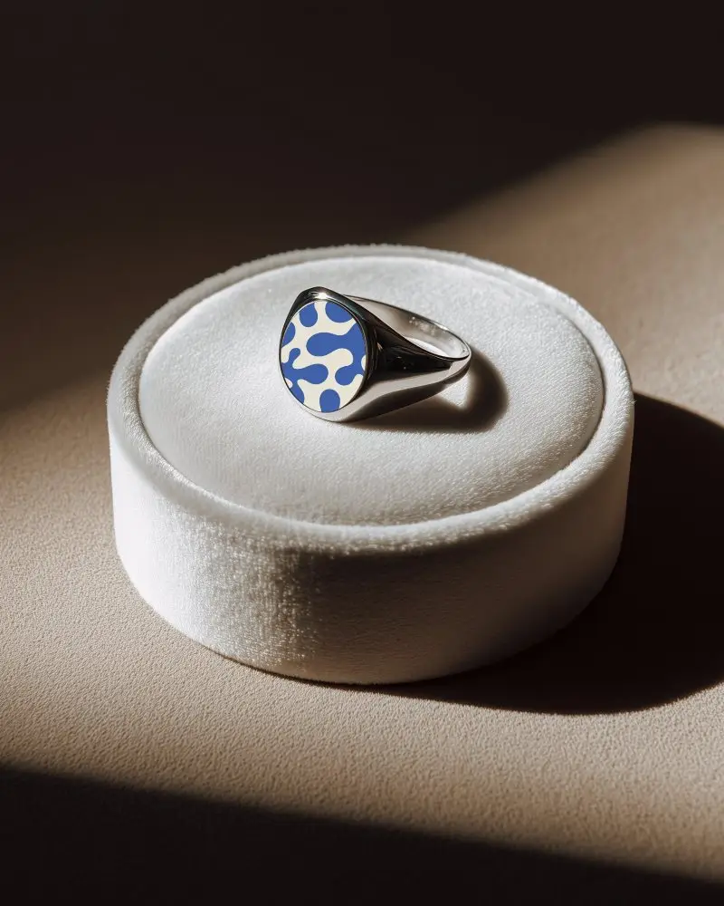 Contemporary Signet Ring Mockup Displayed On Velvet Platform With Spotlight For Advertising Use