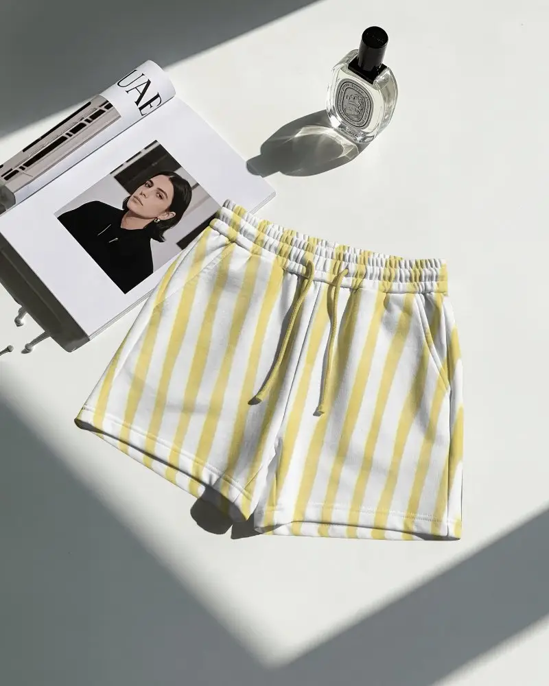 Top View Shorts Mockup Flat Lay With Magazine And Perfume Sharp Sunlight Strong Shadow Contrast