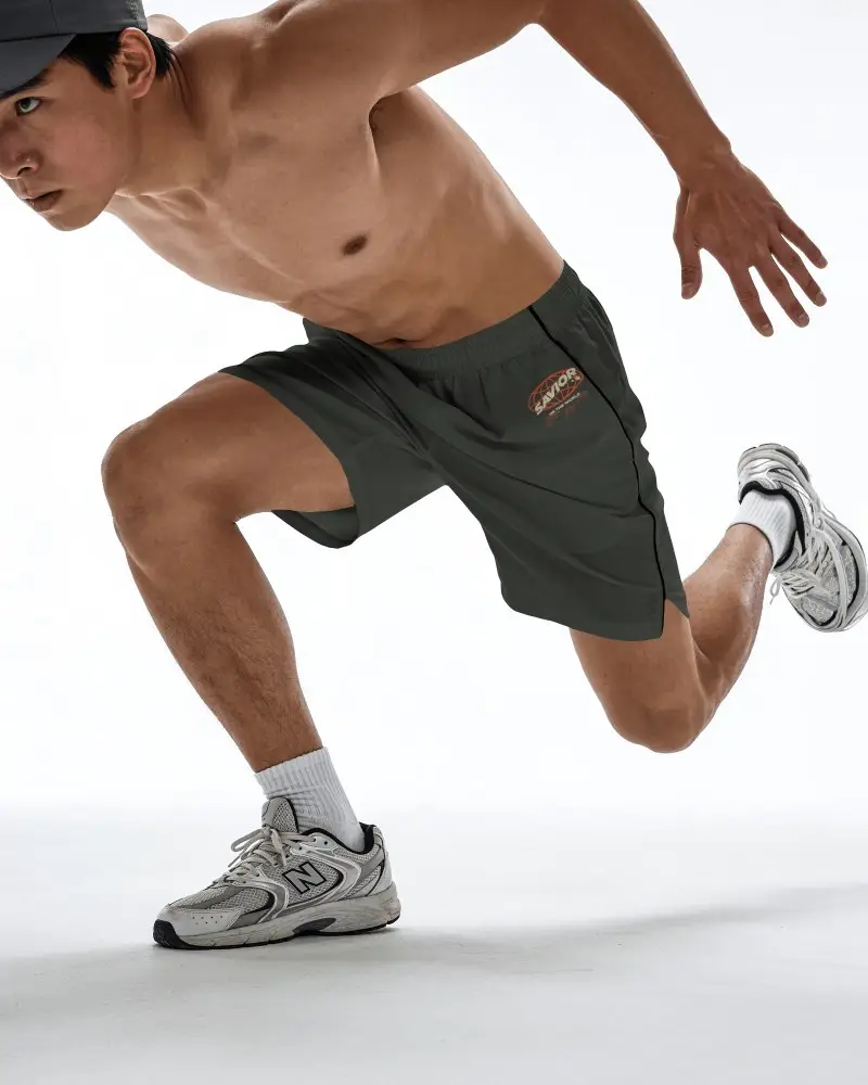 Athletic Running Shorts Mockup Male Model In Dynamic Sprint Pose On Clean White Studio Background