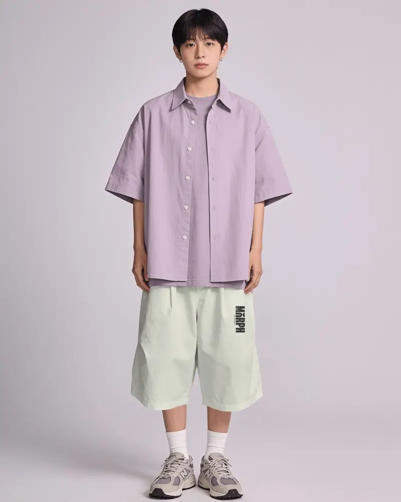 Minimal Studio Shorts Mockup Male Model Standing Front View In Oversized Layered Streetwear Outfit