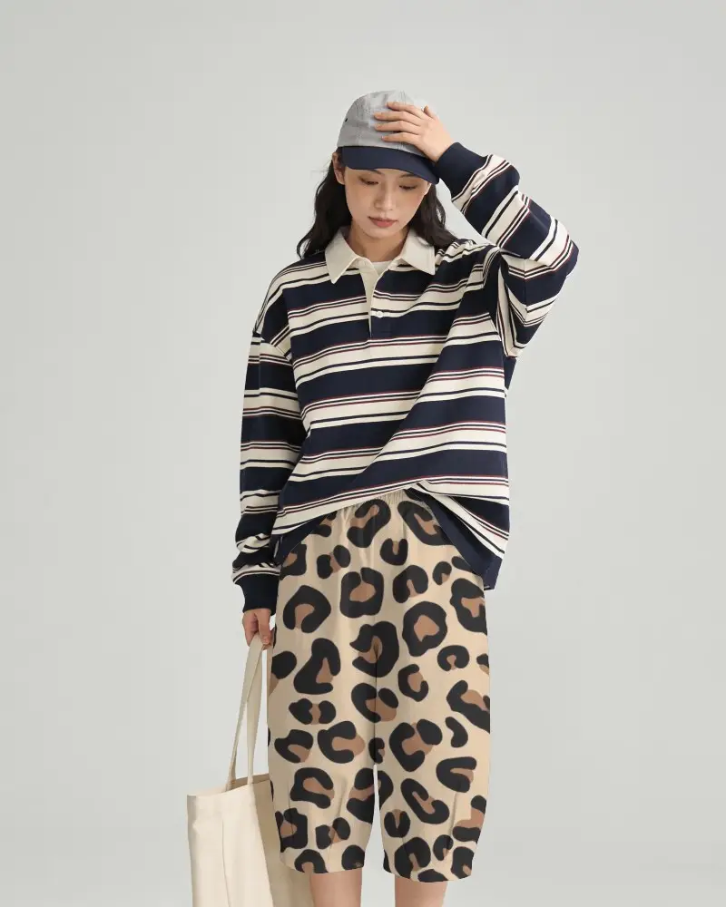 Minimal Studio Shorts Mockup Female Model Wearing Relaxed Fit Bottoms With Striped Oversized Tshirt