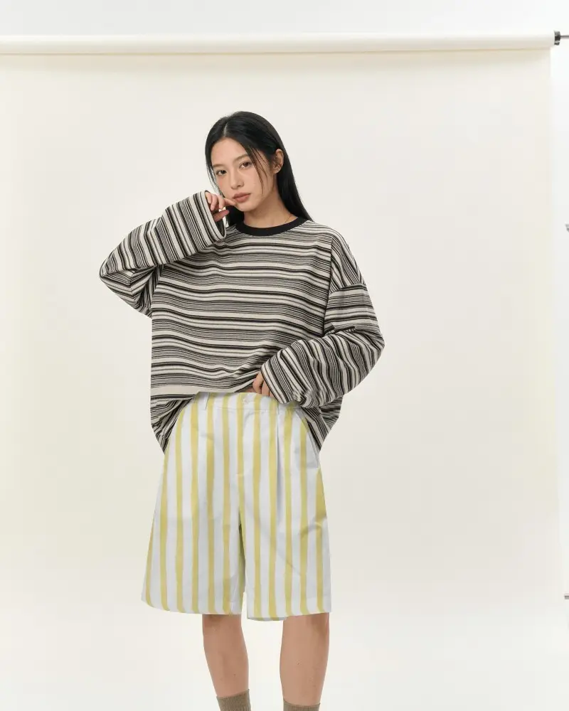 Minimal Studio Shorts Mockup Female Model Wearing Relaxed Fit Bottoms With Oversized Striped Sweater