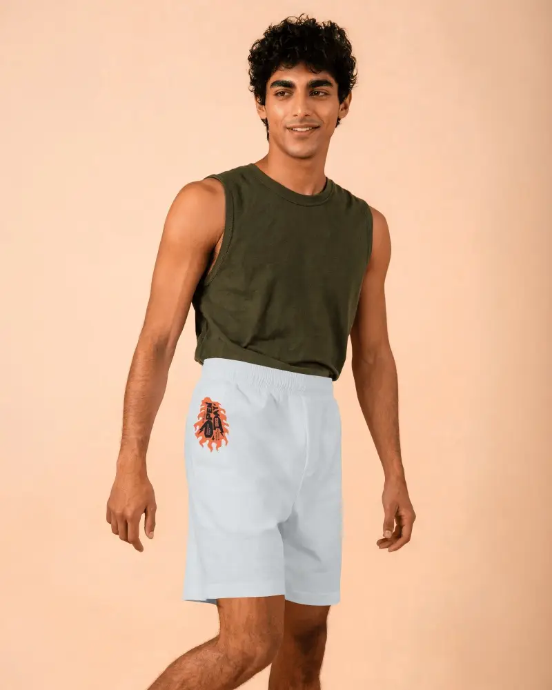 Mens Summer Shorts Mockup With Smiling Model In Sleeveless Top And Warm Studio Background