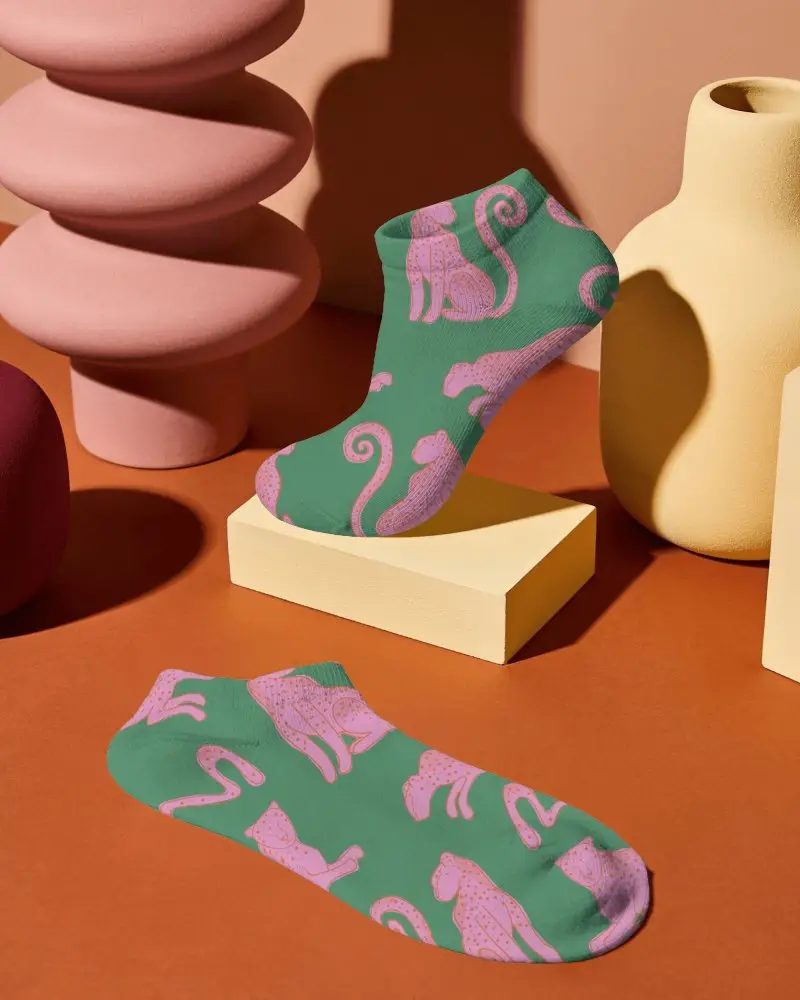 Sculptural Ankle Socks Mockup With Two Socks Displayed Among Abstract Ceramic Forms And Geometric