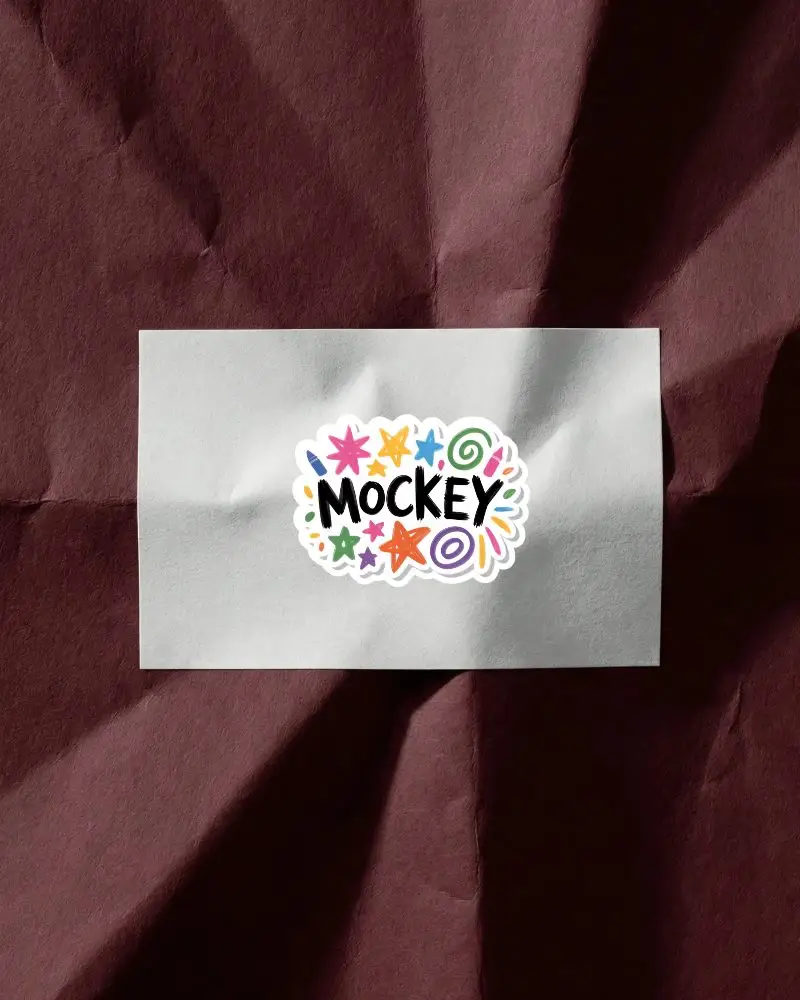 Realistic Crumpled Paper Sticker Mockup On Textured Background For Design Presentation